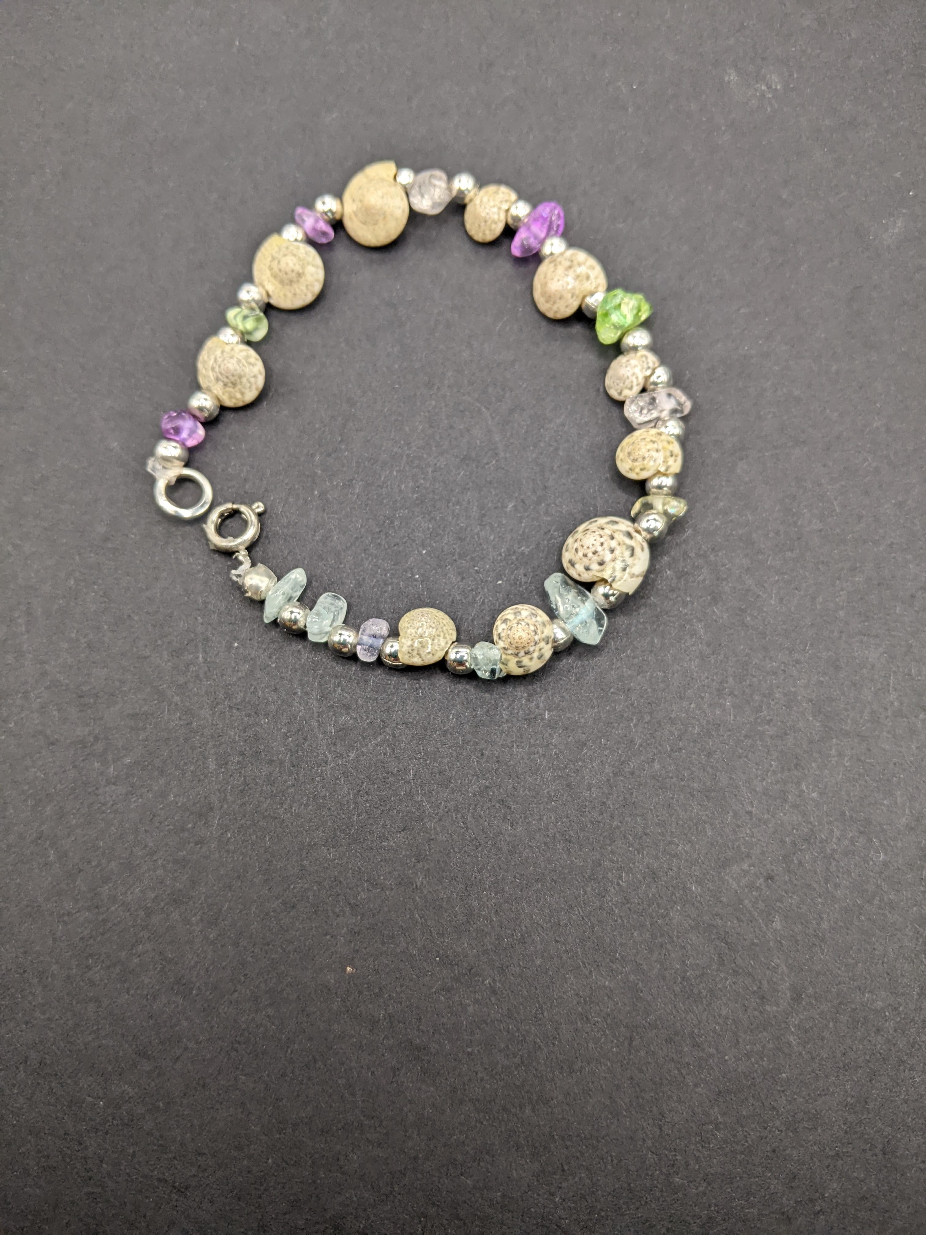 Spiral shells and glass bits bracelet