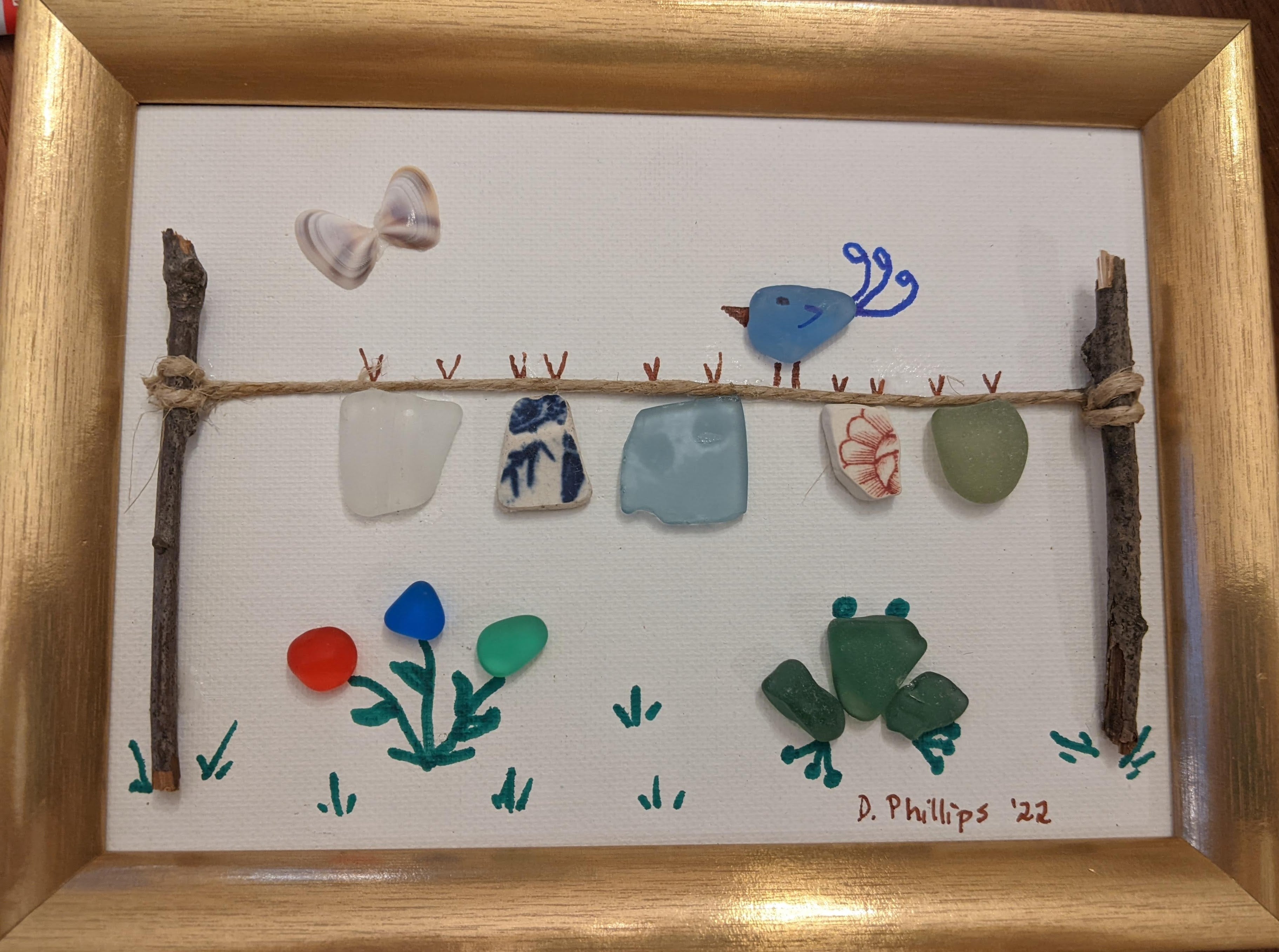 Clothesline with bird, butterfly, and frog
