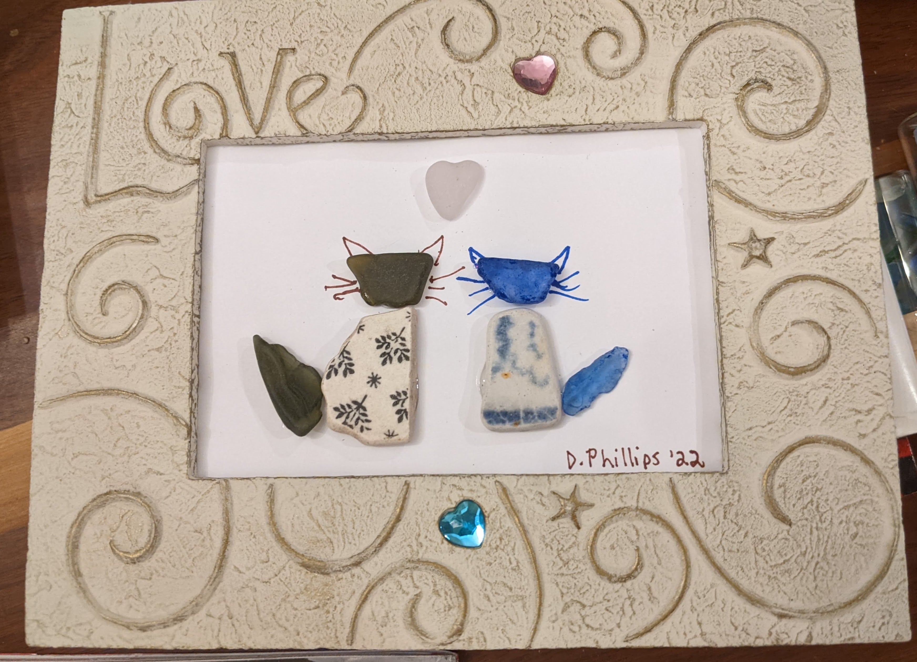 Two seaglass and sea pottery cats in Love frame
