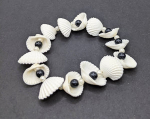 White and black shell and bead bracelet