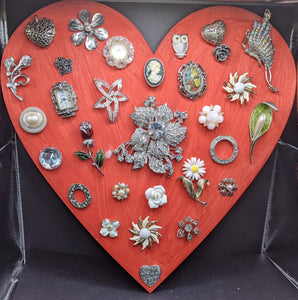 Large red heart with vintage jewelry