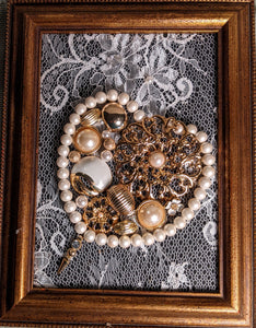 Vintage jewelry heart on lace background